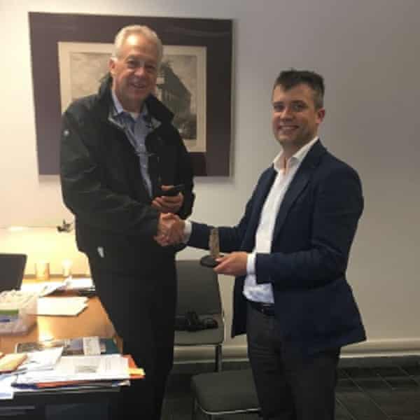 Bob Martin returning a figurine to Paestum director Gabriel Zuchtriegel.