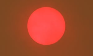 The sun glows red during the ACT bushfires