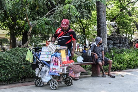 Jose Quizon built the push cart that now carries his home and livelihood from scrap materials