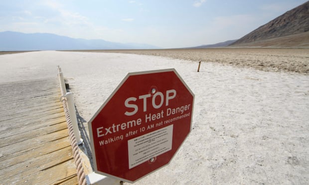 Signage at the salt flats inside Death Valley national park in California warns of extreme heat.