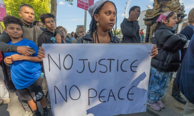 Protesters wave signs during the demonstration.