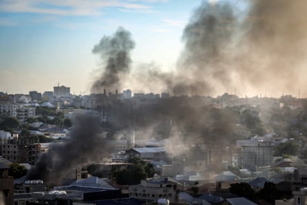 Thick black smoke over houses