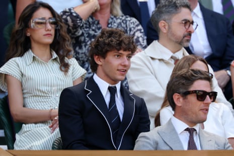 Formula One racing driver Andrea Kimi Antonelli awaits the action on Centre Court.
