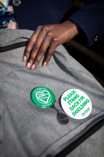 Miranda Ashitey’s bag with badges saying she is shielding