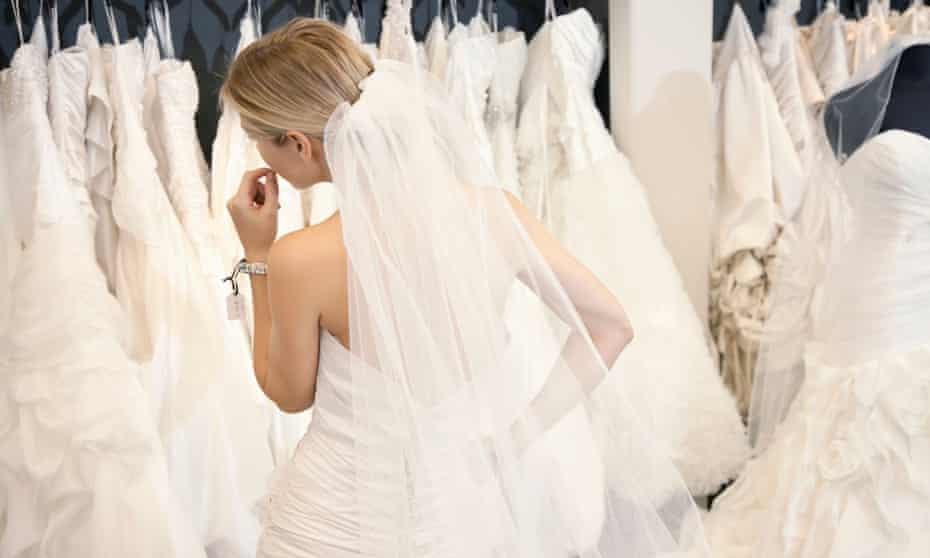 Woman looking at bridal gowns