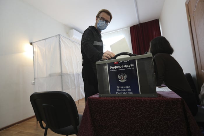 A man from Ukraine’s occupied Luhansk region votes at a temporary accommodation facility in Volgograd, Russia.