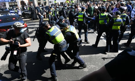 Police scuffle with protesters during an anti-lockdown protest in Melbourne in September 2020