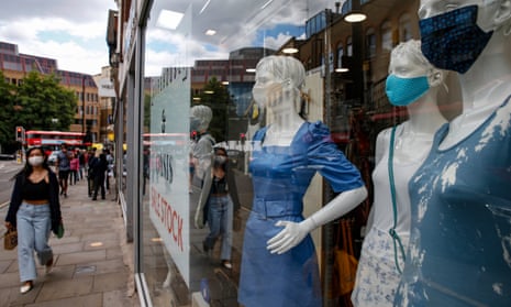 Mannequins wearing face masks in a shop window in Islington, north London.