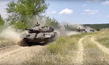 Russian tanks on the move in an unidentified area of Ukraine