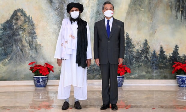 The Chinese foreign minister, Wang Yi, meets the Taliban’s Abdul Ghani Baradar in Tianjin, China, last month.