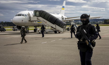 Security forces secure the area during the arrival of Volodymyr Zelenskiy at Zurich airport.