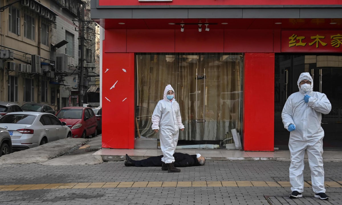 A man lies dead in the street: the image that captures the Wuhan ...