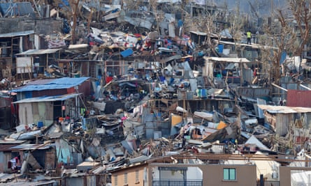 Jumbled remains of shacks on hillside