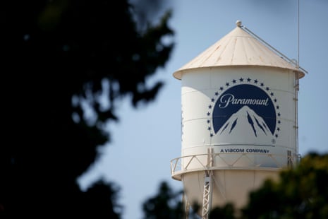 The Paramount Studios water tower with the iconic logo and mountain design against a clear sky