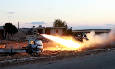 Free Syrian Army Sultan Murad Brigade members fire a rocket in the town of Azaz town in Aleppo.