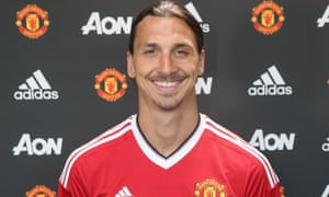 Zlatan Ibrahimovic poses in a Manchester United shirt having joined the club on a one-year contract.