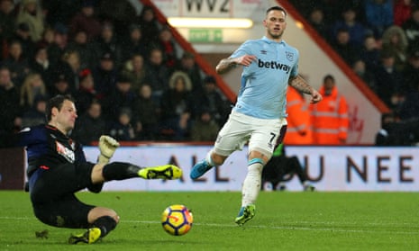 Bournemouth goalkeeper Asmir Begovic slips as he tries to clear the ball leaving West Ham United’s Marko Arnautovic to score his side’s second goal.