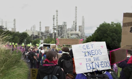 Environmental activists march towards the Ineos factory in Grangemouth.