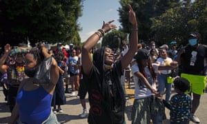 People dance to music during a Juneteenth celebration in Los Angeles, Friday, June 19, 2020.
