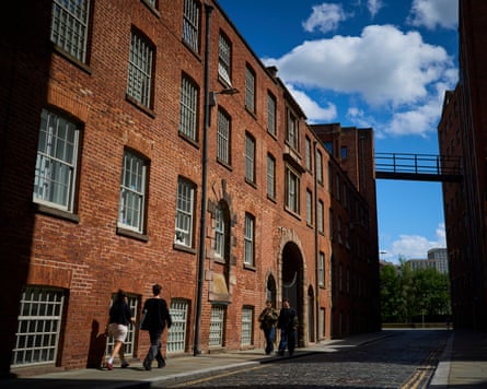 Street in Ancoats with redbrick former industrial buildings.
