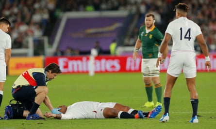England’s Kyle Sinckler is treated on the pitch before having to go off following a third-minute collision