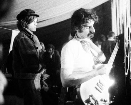 Frank Zappa playing guitar on stage with a member of his band Frank Zappa playing guitar on stage with a member of his band