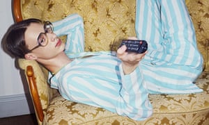 Feeling like a Sunday morning: man on sofa wearing pyjamas