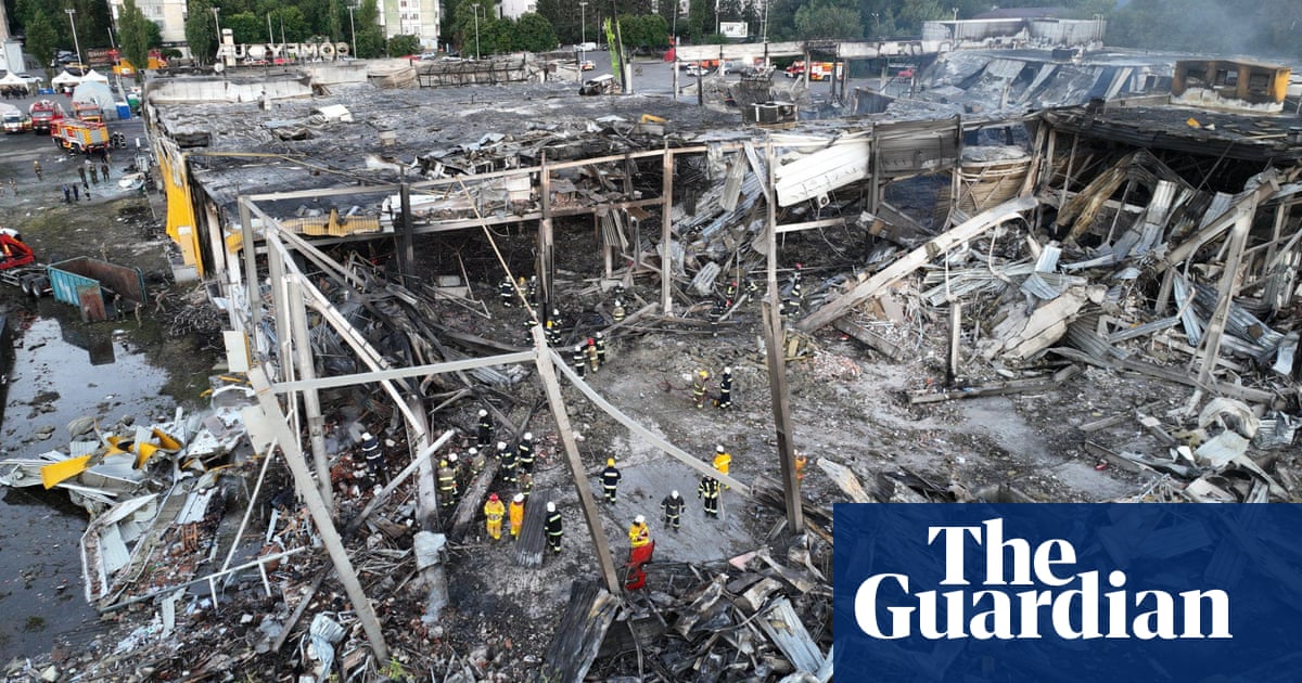 'Is anyone alive?': rescuers search rubble of Ukrainian shopping centre – video report