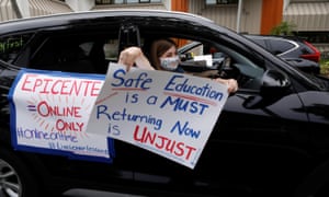 Florida teachers hold a car parade protest in front of the Pasco county school district office on 21 July.
