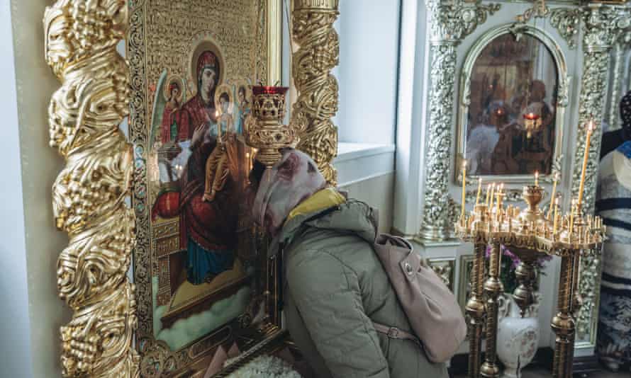 People attend a church service at All Saints’ Church in Bakhmut, Ukraine on May 22, 2022.