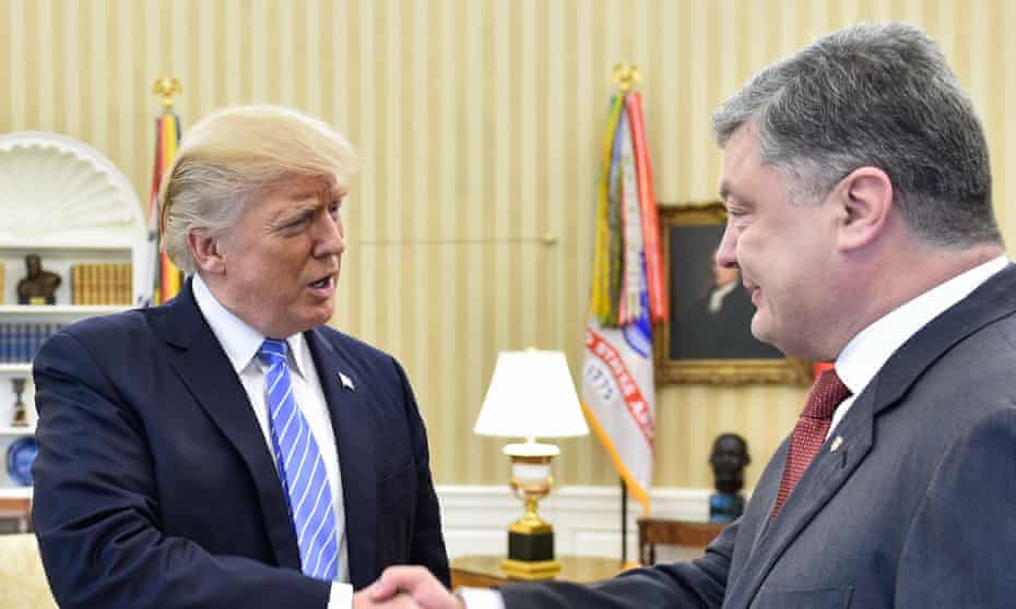 Donald Trump shakes hands with Ukraine’s president, Petro Poroshenko.