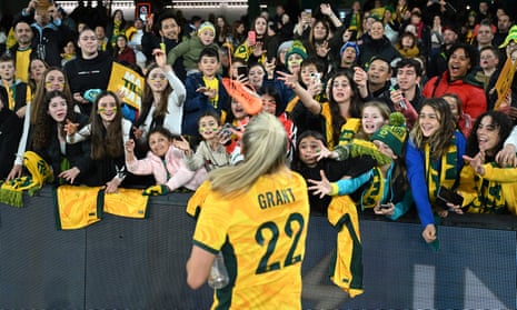 Charlotte Grant of the Matildas tosses a shoe to the crowd at Marvel stadium in Melbourne