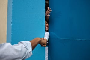 20 March, 2011 the president fist-bumps a young boy in Rio de Janeiro