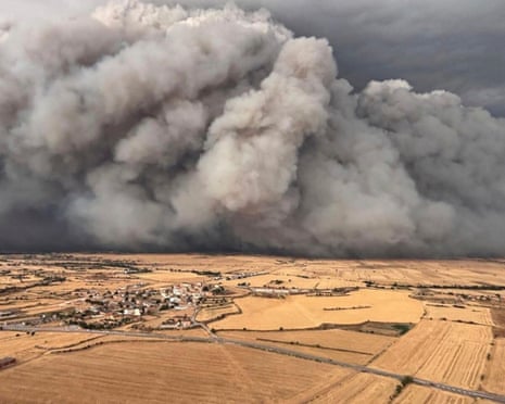 In this photo released by Agents Rurals de Catalunya, uncontrolled fire rages across the grasslands in the Segarra region, in the rural province of Lleida, Spain.