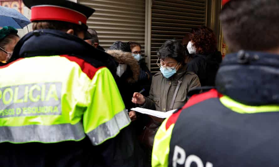 A woman organises an electoral team at a polling station at San Antoni market in Barcelona