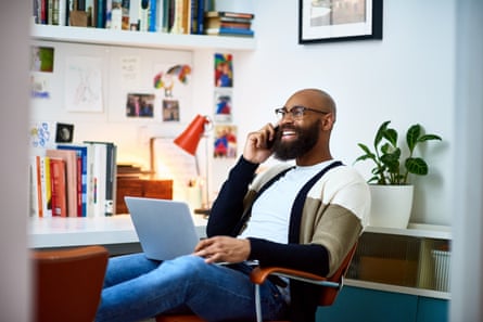 Man with laptop talking on a mobile phone