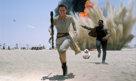 Actors Daisy Ridley and John Boyega in Star Wars VII: The Force Awakens