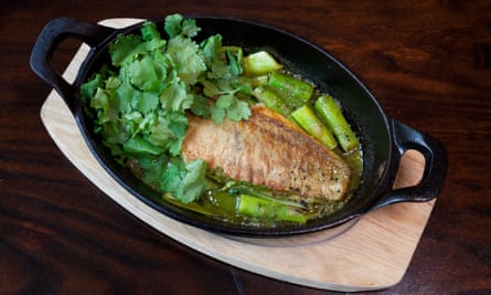 Light and fresh: trout with greens and cilantro baked in almond butter.