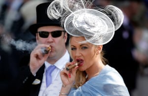 A lady with cigar in the Royal Enclosure during day three of Royal Ascot