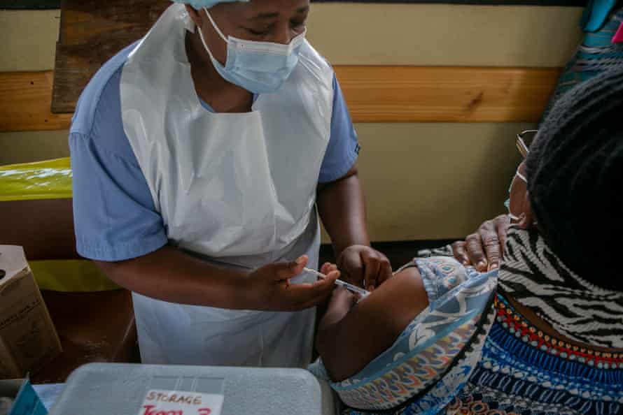 An elderly woman in vaccinated at a local hospital on 29 March in Harare, Zimbabwe.