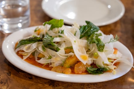 A fresh salad on a small plate.