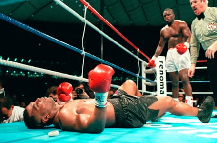 Mike Tyson is knocked out by challenger James “Buster” Douglas in 1990.