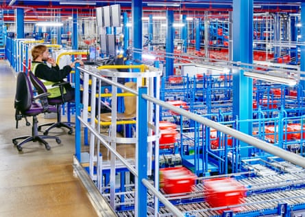 Conveyor belts ferry crates to human pickers at Ocado