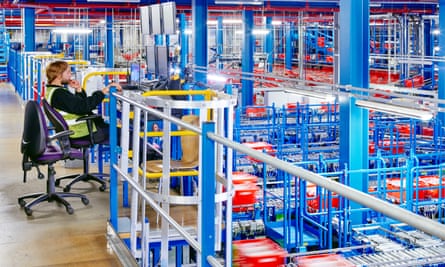 Automated grocery shopping being picked at an Ocado warehouse.