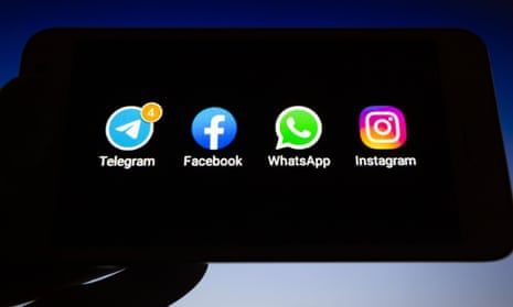 Apps icons of Telegram, Facebook, WhatsApp and Instagram on a smartphone