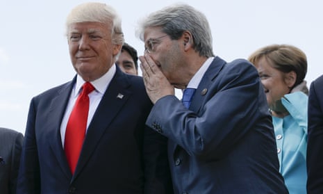 Italian Premier Paolo Gentiloni talks to U.S. President Donald Trump during a G7 summit in Taormina, Italy, Saturday, May 27, 2017. Perhaps he’s whispering that climate change is real and withdrawing from the Paris treaty is a stupid idea.