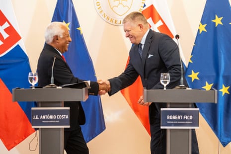 President of the European Council António Costa and Slovak prime minister Robert Fico shake hands at a press conference.