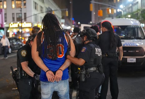 New York police arrest a fan amid the celebrations after Game 4 on Wednesday night in New York.