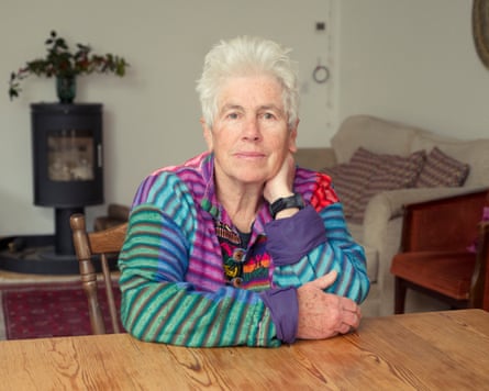 Angie Zelter sitting at a table at home