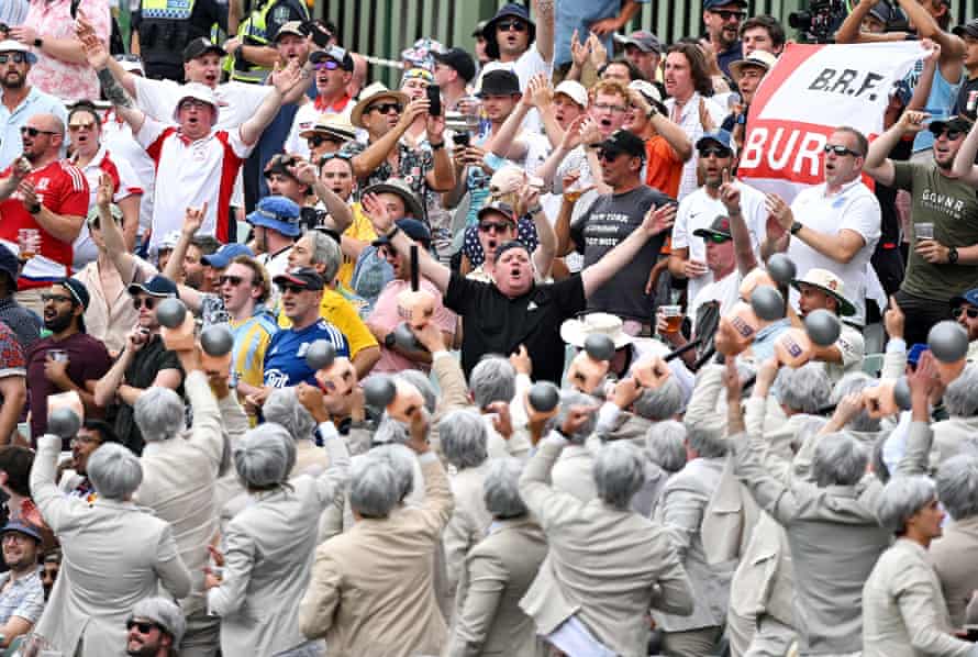 England’s cricket supporters club ‘Barmy Army’ (back) react with Australia’s cricket supporters ‘The Richies’ (front), named after former Australian cricketer Richie Benaud.
